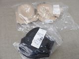 two pairs of gloves and a pair of gloves on the floor