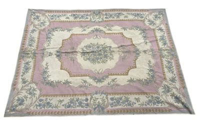 une image représentant un tapis rose et bleu sur fond blanc