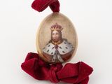 a picture of a miniature picture of a man wearing a crown