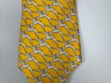 a yellow neck tie with white birds on it