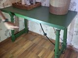 a green table with a basket on top of it