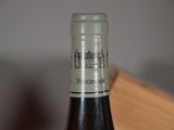 a bottle of wine that is sitting on a table