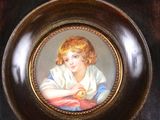 a picture of a young girl holding an apple in a picture frame