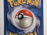 a close up of a pokemon card on a white surface