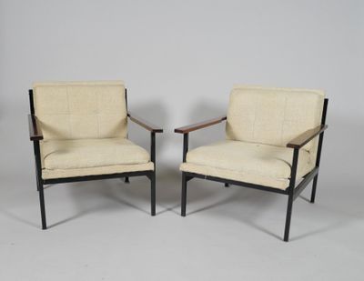 a pair of mid century modern lounge chairs