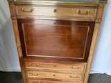an image of a wooden cabinet with drawers and a mirror on top of it