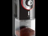 a close up of a coffee grinder on a black background
