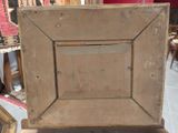 a picture of an old wooden picture frame on a table