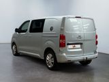a picture of a silver van parked in a white room
