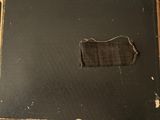 a piece of fabric that has been cut off of a book