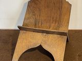 a wooden chair that is sitting on the floor