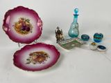 two plates and a vase on the table