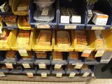 many boxes of food on the shelves in the store