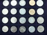 a lot of different coins in a black box