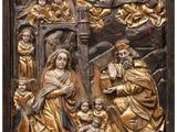 a gold relief of the nativity of jesus and his family