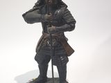 a statue of a man in armor holding a sword