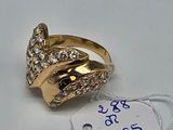 a gold ring with diamonds on it and a price tag