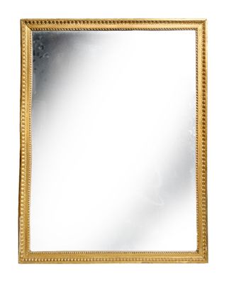a gold framed mirror on a white background