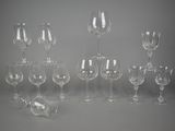 many empty wine glasses sitting on a table