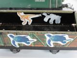 a toy train car that has stickers on the side of it