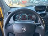 steering wheel of a car with a clock on the dashboard