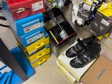many boxes of shoes on the floor in a store