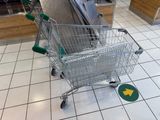 a shopping cart sitting on the floor in a store