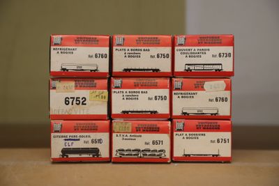 many boxes of toy trains sitting on a table