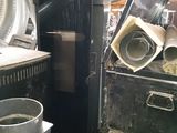 a lot of old appliances that are sitting in a room
