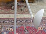 a lamp that is sitting on a rug in a room
