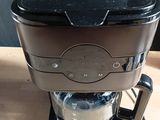 a coffee maker that is sitting on a table