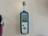 a close up of a thermometer on a table