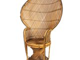 a wicker chair with a wicker seat on a white background