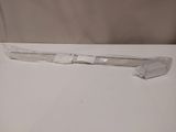 a toothbrush that is wrapped in plastic on a table