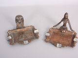 two metal objects that are sitting on a table