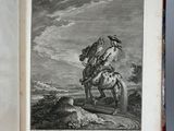 an old book with a picture of a man on a horse
