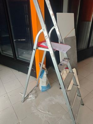 a ladder that is leaning up against a wall