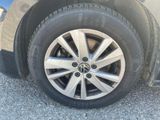 a close up of a tire on a car ' s rim