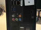 a computer on a table with a price tag on it
