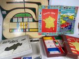a lot of board games that are on the table