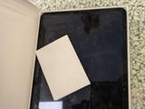 a box with a piece of paper in it sitting on the floor