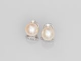 a pair of pearl and diamond earrings