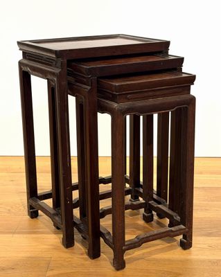 three wooden tables sitting on top of a hard wood floor