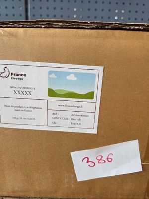 a cardboard box with a sticker on it sitting on the floor