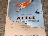 a book on the floor with a picture of a woman in an orange dress