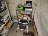 a small room with a shelf and a chair in it