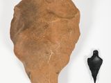 an image of a piece of pottery with a black object