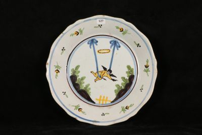 a plate with a bird on it on a black background