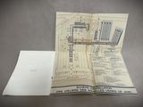 a map of a city on a table with a piece of paper on it