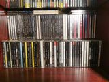a lot of dvds on a shelf in a room